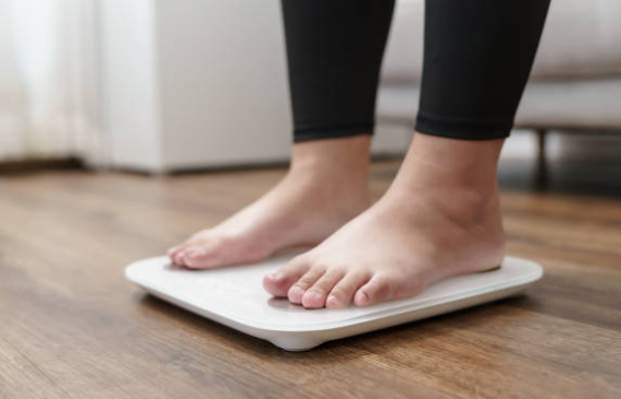 Person standing on a smart body-composition scale